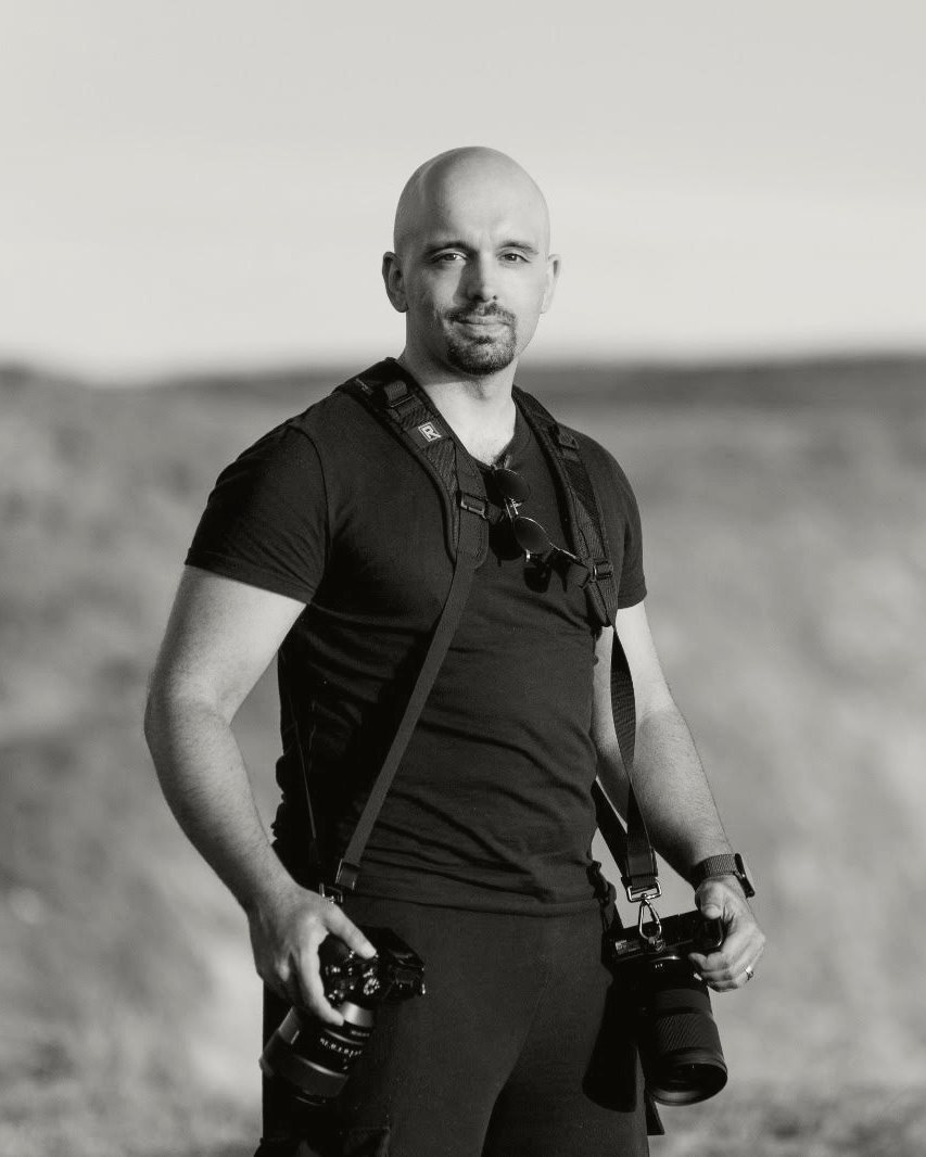 Pedro de Sousa, Hertfordshire wedding photographer, holding his two cameras